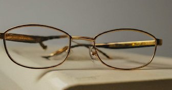 Eyeglasses resting on a document, symbolizing poll watcher observations and concerns about election integrity