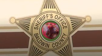 Baldwin County Sheriff’s Office badge; symbolizes lack of accountability and transparency in police investigations
