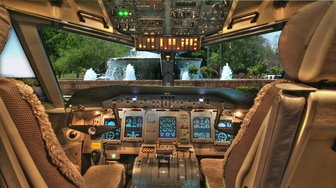 Aircraft cockpit view shows runway and fountain; Fairhope Airport expansion raises questions about future development plans