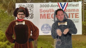 Political satire: Candidates Dorsey & Elliott in dog costumes, referencing calls to remove them from Baldwin County elections