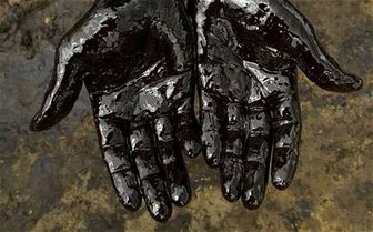 Oil-covered hands symbolize failed Senate candidate Trip Pittman’s connection to a BP scandal and rejection by voters