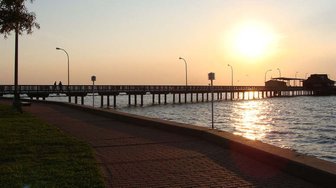 Fairhope pier at sunset; a view representing the city council’s connection to local power structures