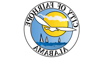 Fairhope city seal depicting a seagull, sun, water, and islands; referenced in discussion of local politics and elected of...