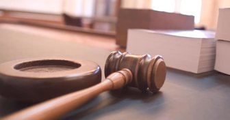 Fairhope City Council settles lawsuits with former employees; gavel and legal documents symbolize the costly outcome