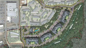 Site plan rendering shows proposed Fly Creek Apartments complex, surrounded by trees, awaiting council approval for a mult...