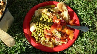 Bowl of food on grass, possibly representing community discussions around repurposing the former K-1 school site in Fairhope