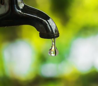 Leaking faucet symbolizing confidential information leaks at Fairhope City Hall, as reported by Gulf Coast News