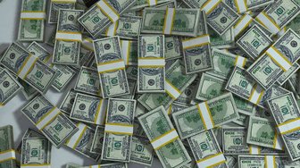 Stacks of US currency symbolize alleged corruption among Baldwin County, Alabama elected officials