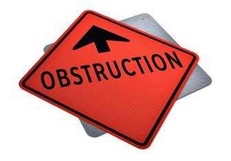 Warning sign reading Obstruction, symbolizing resistance from Fairhope City Council against the mayors recommendations