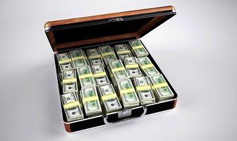 Suitcase filled with US currency, potentially representing financial interests influencing a land dispute case involving M...