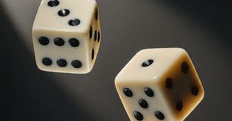 Two dice against a dark background, representing Alabama’s ongoing debate about establishing a state lottery