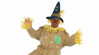 Man dressed as a scarecrow, symbolizing a straw man lawsuit revealing complex Baldwin County business partnerships
