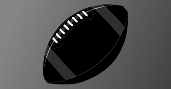 American football resting on a gray background, representing Super Bowl LV competition between Chiefs and Buccaneers