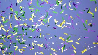 Confetti falling against a blue background; symbolizing ongoing efforts despite setbacks in Fairhope development disputes