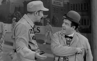 Vintage airport scene: two men in uniform and a bowler hat discuss ground lease agreements related to Fairhope Airport