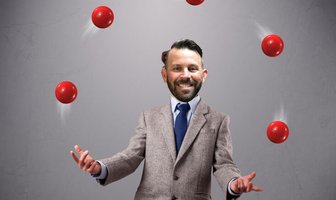 Man in suit juggling red balls, symbolizing shifting political alliances and unexpected outcomes in the County Commissione...