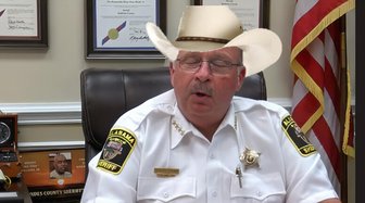 Alabama sheriff in uniform and cowboy hat; represents concerns over political corruption and white collar crime impacting ...